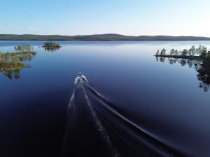 an island in the middle of a large lake at Villa Sarmi - a true off-the-grid hut in Inari