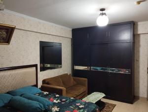 Ένα ή περισσότερα κρεβάτια σε δωμάτιο στο Cibubur Village Apartment