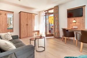 TV a/nebo společenská místnost v ubytování Apparthotel Minerva Diana Octavia