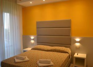 Postel nebo postele na pokoji v ubytování Hotel Mirage