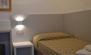 Postel nebo postele na pokoji v ubytování Hotel Mirage