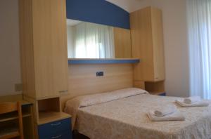 Postel nebo postele na pokoji v ubytování Hotel Mirage