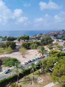 an aerial view of a parking lot with palm trees at Apartamento CABO HUERTAS in Alicante