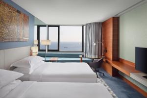 A bed or beds in a room at Sheraton Istanbul Atakoy Hotel