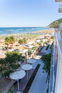 a view of the beach from the balcony of a resort at Strand Hotel in Gabicce Mare