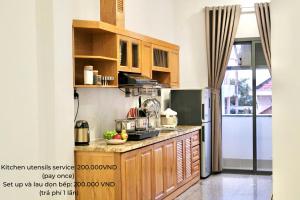 Kuchyň nebo kuchyňský kout v ubytování Kim Minh Apartment & Hotel