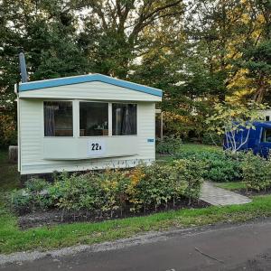 a tiny house with the number on it at Stacaravan in De Pol