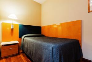 Postel nebo postele na pokoji v ubytování Hotel Villacarlos
