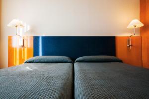 Postel nebo postele na pokoji v ubytování Hotel Villacarlos