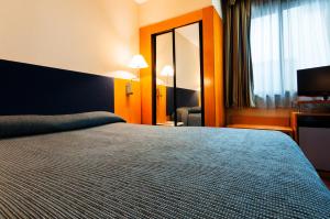 Postel nebo postele na pokoji v ubytování Hotel Villacarlos
