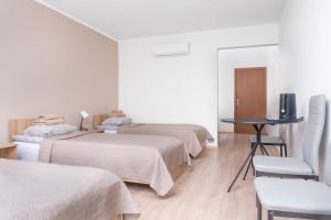 Postel nebo postele na pokoji v ubytování KAUNO JACHTKLUBAS Baltosios Burės
