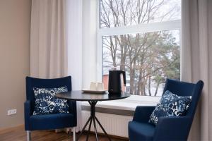 Posezení v ubytování KAUNO JACHTKLUBAS Baltosios Burės