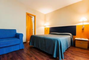 Postel nebo postele na pokoji v ubytování Hotel Villacarlos