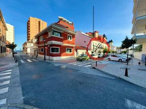 an empty street in a city with a building at Martin´s Place 80 Mts To Beach in Fuengirola
