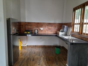 a kitchen with a counter top in a room at Villa Tanzanite in Tangalle +11 photos
