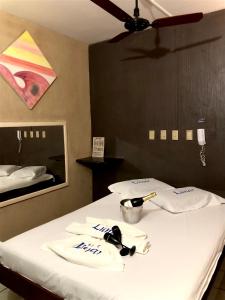 En eller flere senge i et værelse på Hotel Lunar