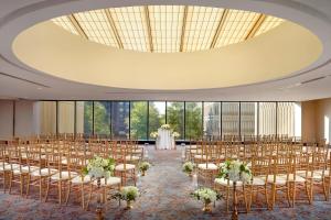 a room with rows of chairs and a wedding at The Westin Peachtree Plaza, Atlanta in Atlanta +37 photos