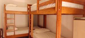 Кровать или кровати в номере Residencial Sol e Mar de Floripa