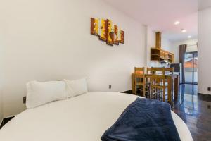 Postel nebo postele na pokoji v ubytování Kim Minh Apartment & Hotel