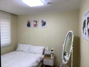 Postel nebo postele na pokoji v ubytování Sky Garden