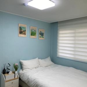 Postel nebo postele na pokoji v ubytování Sky Garden