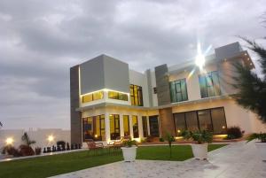 a large building with a lot of windows at calm chalet گالم شالية in Ţaymissah