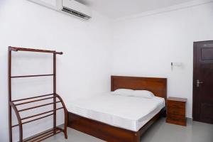 Ένα ή περισσότερα κρεβάτια σε δωμάτιο στο Dawood Villa