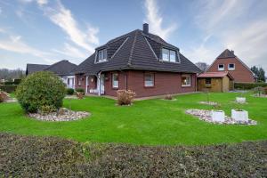 Aed väljaspool majutusasutust Ferienhaus Deichliebe - Ihr Rückzugsort an der Nordsee