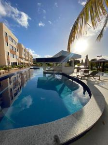 Swimmingpoolen hos eller tæt på Guarajuba - Paraiso dos Coqueiros BA + 12 billeder