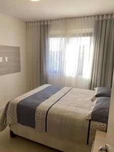 En eller flere senge i et værelse på Guarajuba - Paraiso dos Coqueiros BA