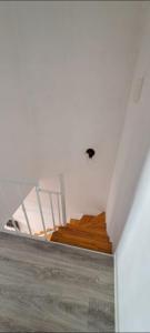 a room with a white ceiling and wooden floors at La historica in Concepción del Uruguay