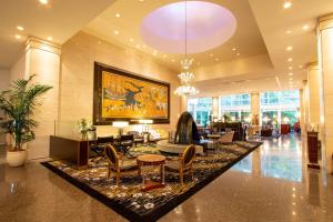 a lobby of a hotel with chairs and a table at The Westin Osaka in Osaka