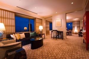 a living room with a couch and a table at The Westin Osaka in Osaka