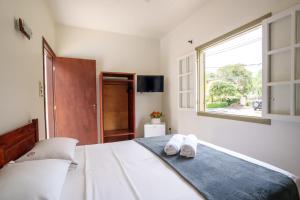 Postel nebo postele na pokoji v ubytování Casa Poema Paraty