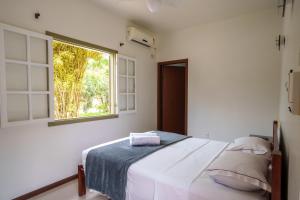 Postel nebo postele na pokoji v ubytování Casa Poema Paraty