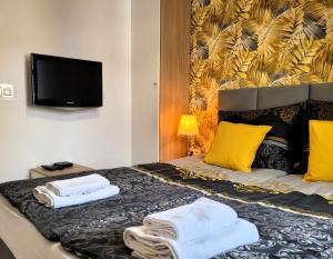 Posteľ alebo postele v izbe v ubytovaní Apartament Przy Placu Piastowskim