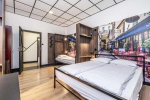 Postel nebo postele na pokoji v ubytování Vola Hostel