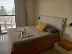 a bedroom with a bed with a view of a balcony at Beach Villa ,Lagoon ,Estoril - Sol y MAR in Sal Rei