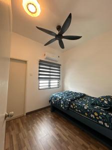 Ένα ή περισσότερα κρεβάτια σε δωμάτιο στο Moonlight Homestay