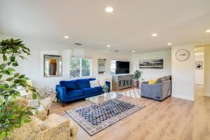 a living room with a blue couch and chairs at BusinessandFamily Retreat Near Levis Stadium! in Santa Clara