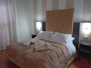 Postel nebo postele na pokoji v ubytování Hotel Sant'Elia