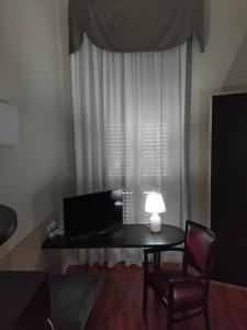 TV a/nebo společenská místnost v ubytování Hotel Sant'Elia