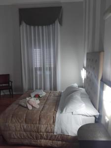 Postel nebo postele na pokoji v ubytování Hotel Sant'Elia