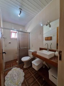 Koupelna v ubytování Casa com piscina em Arroio do Sal