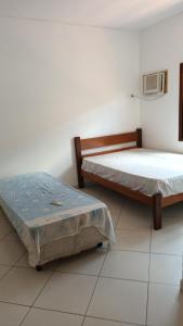 Postel nebo postele na pokoji v ubytování Casa Atlântica - Prox a Praia Enseada