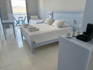 Ένα ή περισσότερα κρεβάτια σε δωμάτιο στο Hotel Fiona Symi