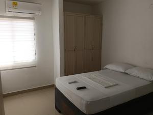 Giường trong phòng chung tại Apartamento d'alessandro