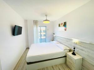 Posteľ alebo postele v izbe v ubytovaní Apartamento Salvis Balcón y piscina