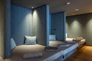 Voodi või voodid majutusasutuse Almwellness Hotel Pierer toas