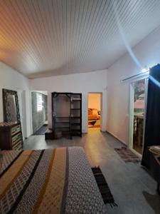 a bedroom with a bed in the middle of a room at Wonderland Villa in Petit-Bourg